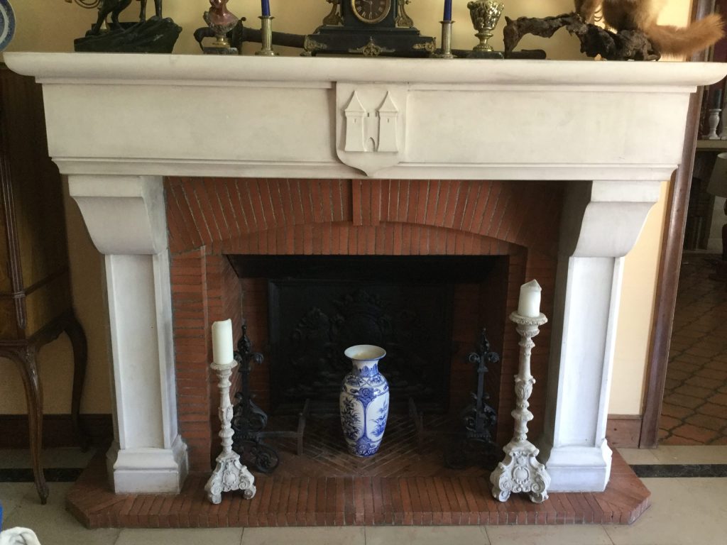 Cleaning an old limestone fireplace
